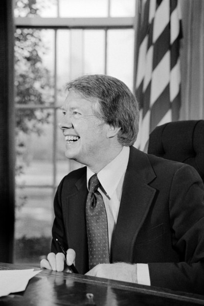 U.S. President Jimmy Carter working on T.V. speech in Oval Office, White House