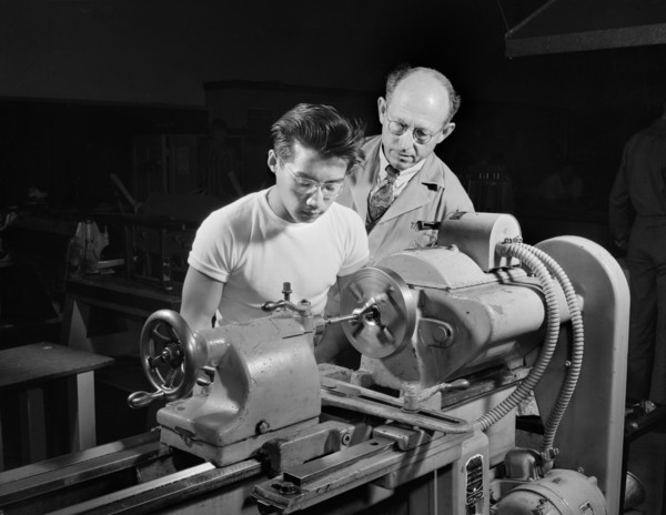 Chinese-American Student learning to operate Lathe to help in War Program