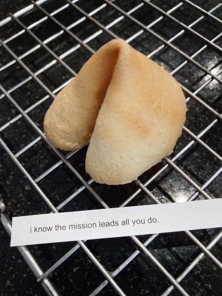 Homemade Fortune Cookie with Fortune Message on Cooling Rack