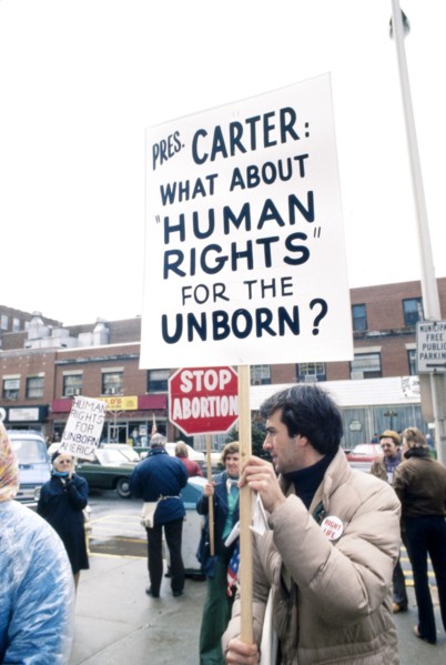 Protesters holding Anti-Abortion Signs