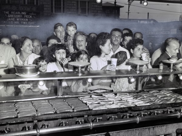 Group of People lined up at Counter