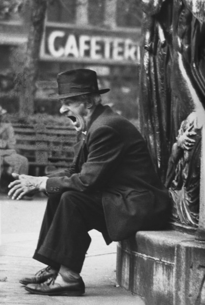 Yawning Man sitting in Union Square Park