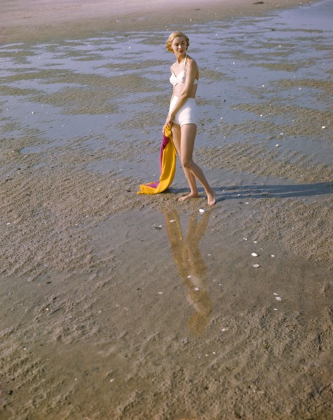 Portrait of Woman in Two-Piece White Bathing Suit on Beach