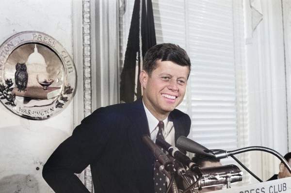 U.S. Senator John F. Kennedy speaking at lectern at National Press Club