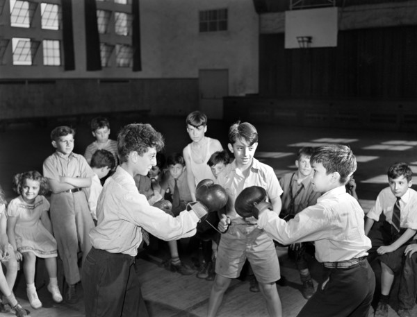 Boys Boxing match in gymnasium of community center