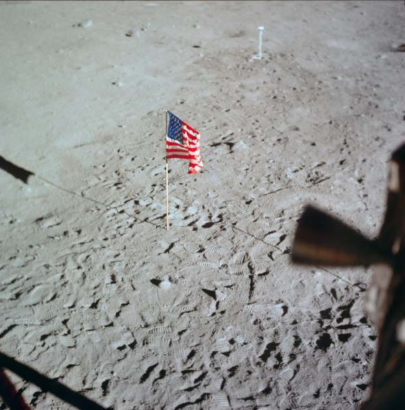 U.S. flag deployed on moon surface surrounded by footprints of astronauts Neil A. Armstrong and Edwin E. Aldrin Jr.