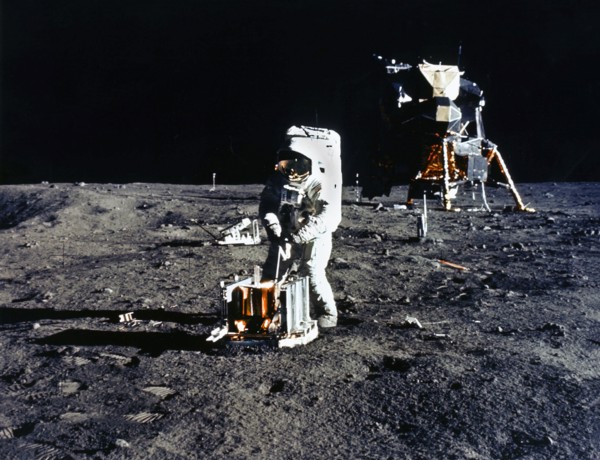 American Astronaut Edwin E. Aldrin deploying passive seismic experiments package (PSEP) during Apollo 11 extravehicular activity