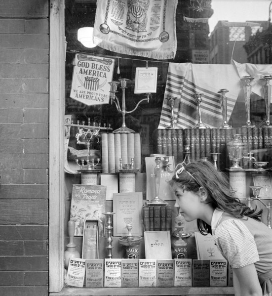 Young girl looking in window of Jewish shop, Broome Street, New York City, New York, USA, Marjory