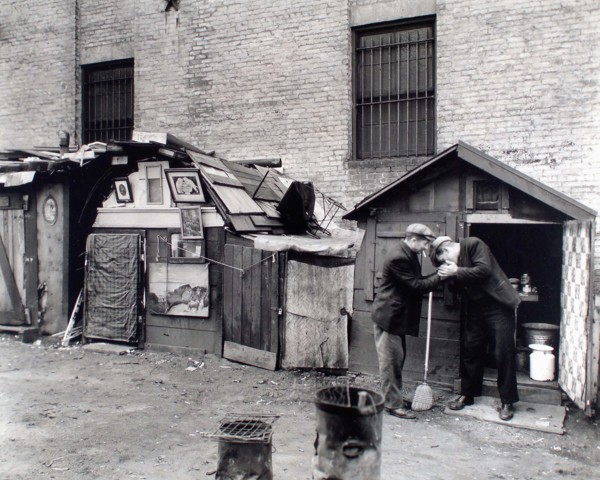 Two homeless men smoking cigarettes, unemployed and huts, West Houston and Mercer Streets, New York