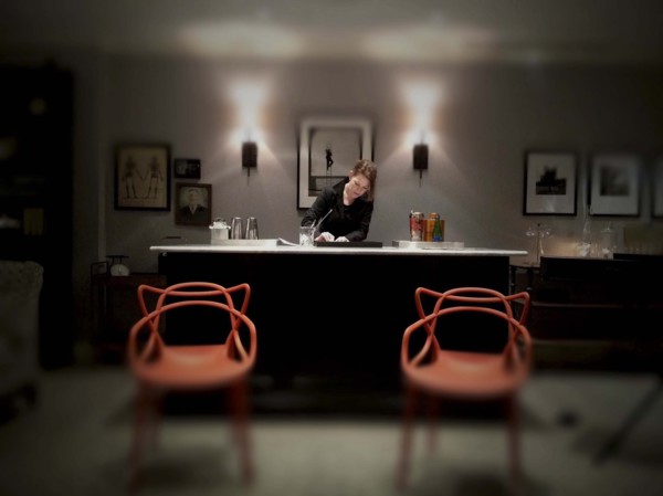 Mid-adult woman working at fancy cocktail bar