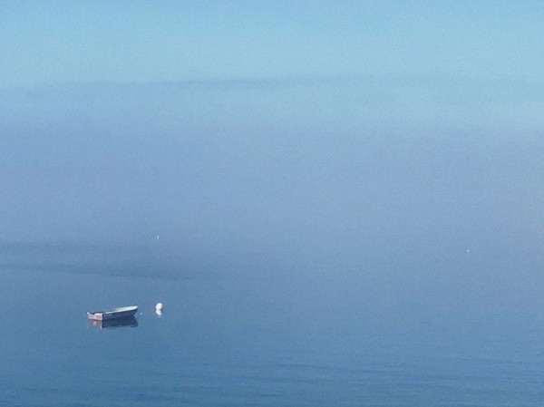 Moored rowboat at sea