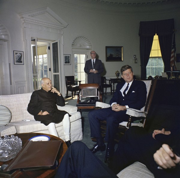 U.S. President John Kennedy (sitting in rocking chair) meeting with Prime Minister of India