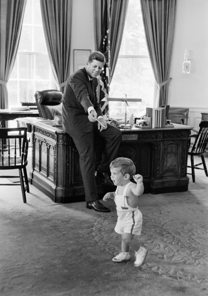 U.S. President John F. Kennedy and his son John F. Kennedy, Jr., in Oval Office, White House,