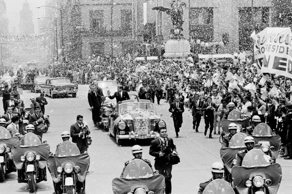 U.S. President John F. Kennedy and Mexican President Adolfo López Mateos waving to crowd from