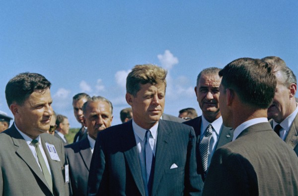 U.S. President John F. Kennedy visiting with astronaut Commander Walter M. Schirra (back to