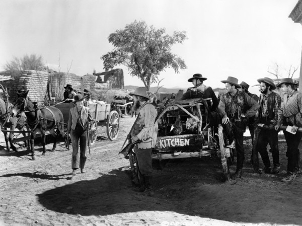 Jean Arthur (standing left with rifle), on-set of the western film, "Arizona", Columbia Pictures,