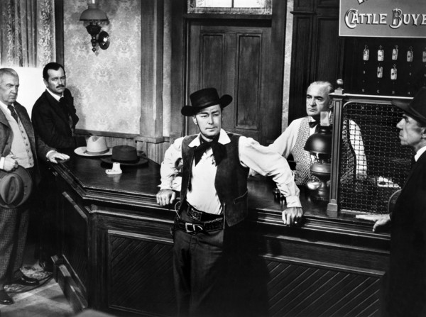Alan Ladd (center), on-set of the western film, "The Big Land", Warner Bros., 1957