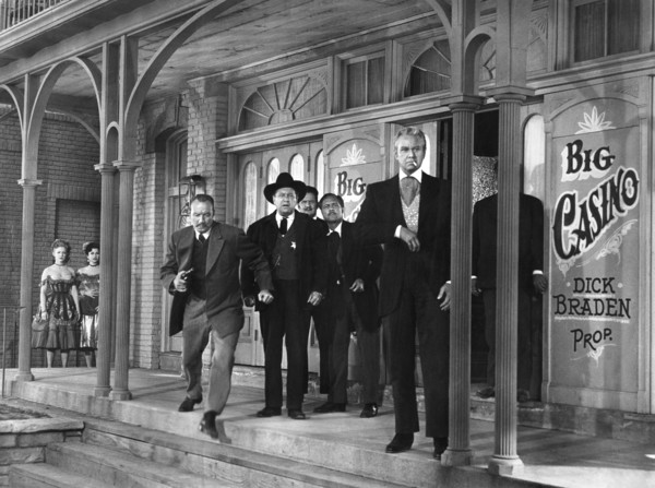 Edgar Buchanan (background, center), David Brian (right), on-set of the western film, "Dawn at