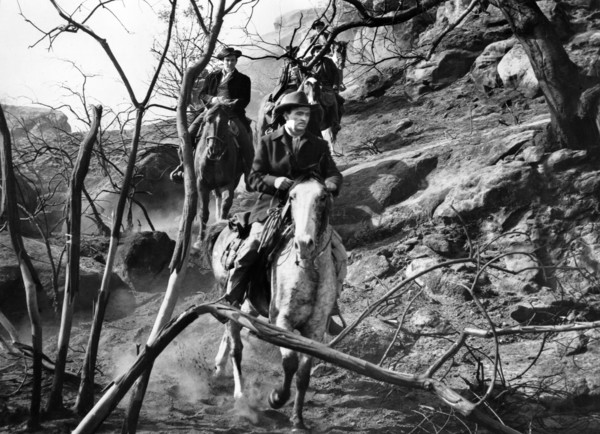 John Lund (foreground), on-set of the western film, "Five Guns West",  American Releasing