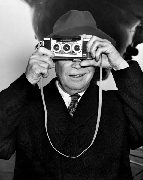 U.S. President Dwight D. Eisenhower photographing his photographers at the airport prior to his