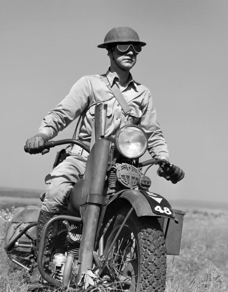 Motorcyclist serving as messenger for his platoon of the mechanized cavalry reconnaissance unit,
