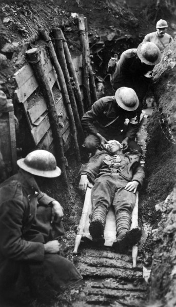 U.S. marine receiving first aid before being sent to hospital in rear of trenches. Toulon Sector,