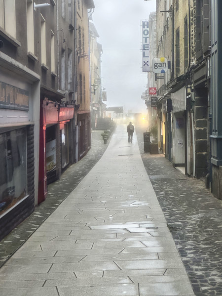 Street scene on foggy morning, Saint-Flour, France