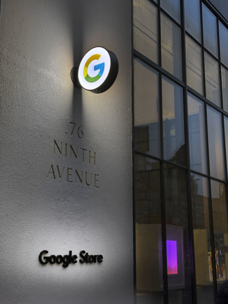 Google store at night, illuminated company logo on building exterior, New York City, New York, USA