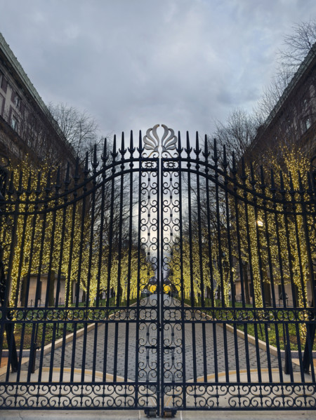 Entrance Gate at College Walk at dusk with illuminated lights wrapped around trees, Columbia
