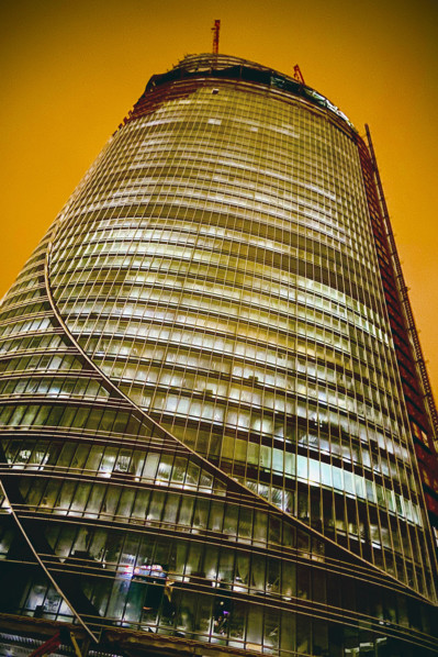 Low angle view of One Congress skyscraper under construction at night, Bulfinch Crossing, Boston,