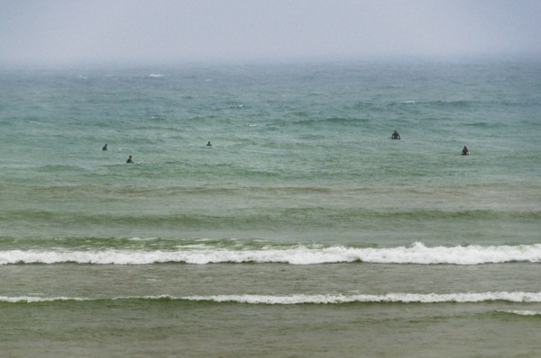 Group of surfers waiting on waves