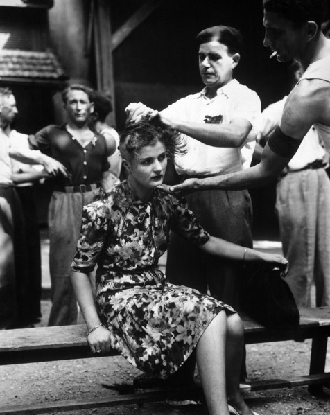 French civilians shaving woman's head as punishment for having personal relations with German