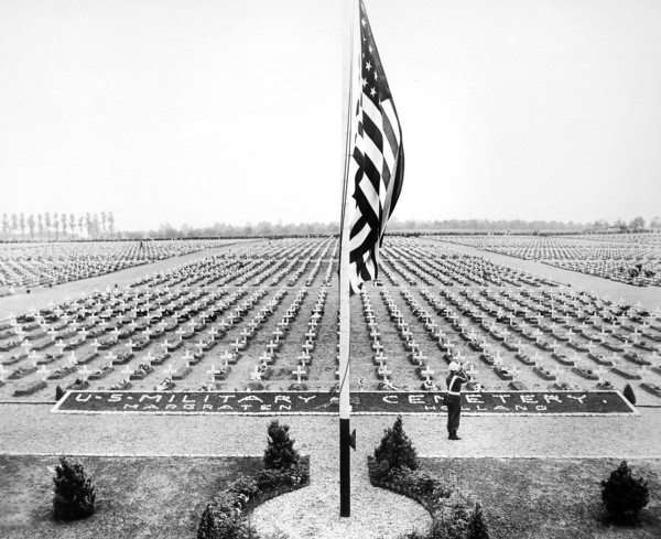 American bugler blowing taps at close of Memorial Day service at Margraten Cemetery, Holland, where