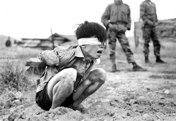 Viet Cong prisoner awaiting interrogation at A-109 Special Forces Detachment, Thuong Duc, South
