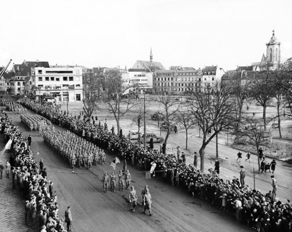 U.S. 28th Infantry Division leading the color guard at Victory Parade after the town's liberation,