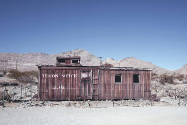 Abandoned Union Pacific train car in desert ghost town, Rhyolite, Nevada, USA