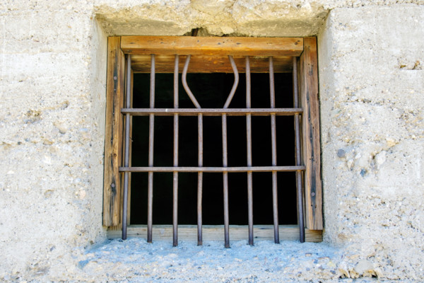 Iron bars on jail window in mining ghost town, Rhyolite, Nevada, USA