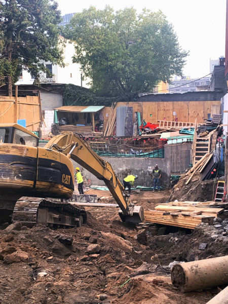 Construction site digging foundation, Brooklyn, New York, USA