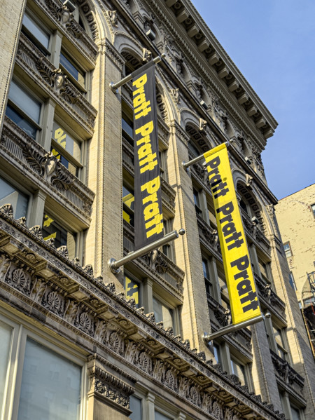 Pratt Institute, low angle view of building exterior and school banners, West 14th Street, New York