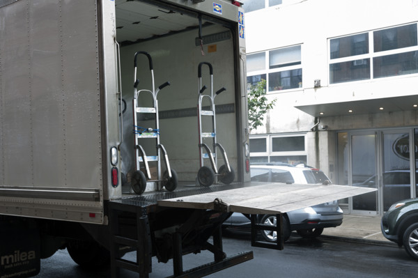 Moving truck parked on street