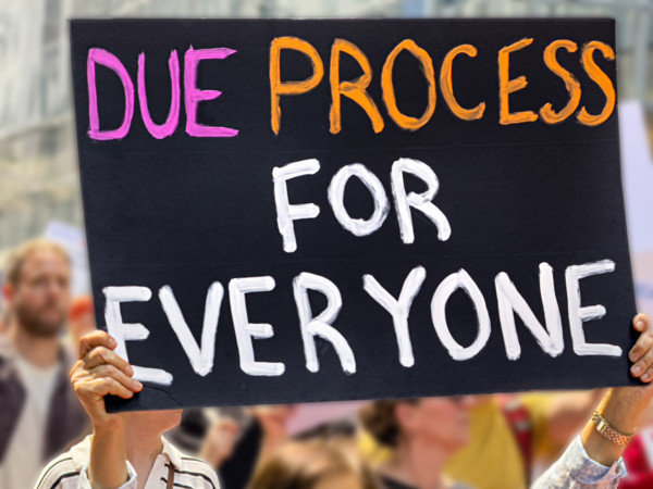Demonstrators participating in "Our City, Our Fight: Protect Migrants, Protect the Planet" protest,