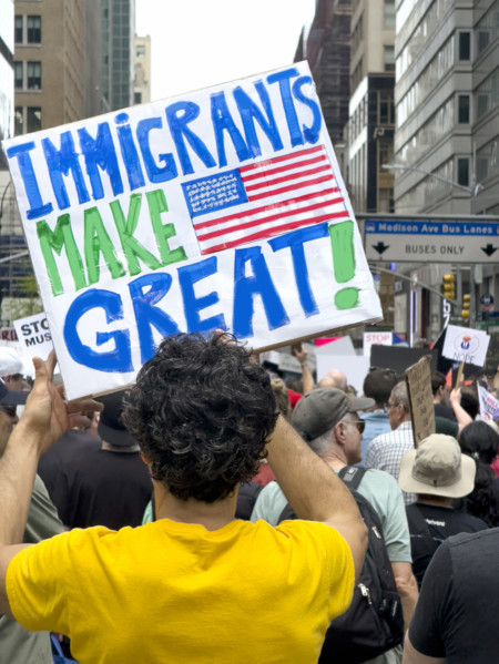 Demonstrators participating in "Our City, Our Fight: Protect Migrants, Protect the Planet" protest,