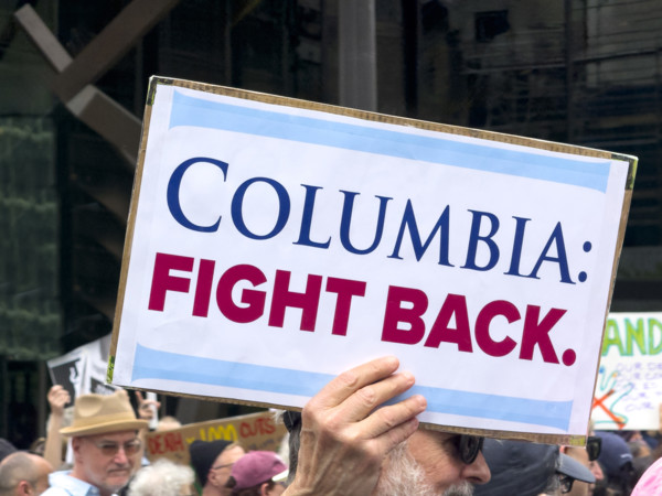 Demonstrators participating in "Our City, Our Fight: Protect Migrants, Protect the Planet" protest,