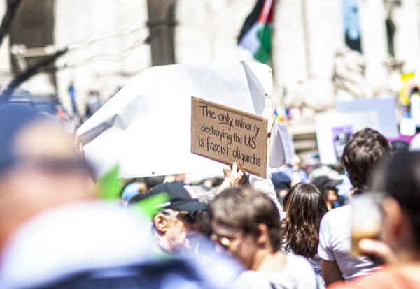 Demonstrators participating in "Our City, Our Fight: Protect Migrants, Protect the Planet" protest,