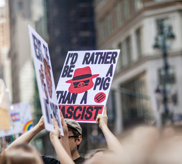 Demonstrators participating in "Our City, Our Fight: Protect Migrants, Protect the Planet" protest,