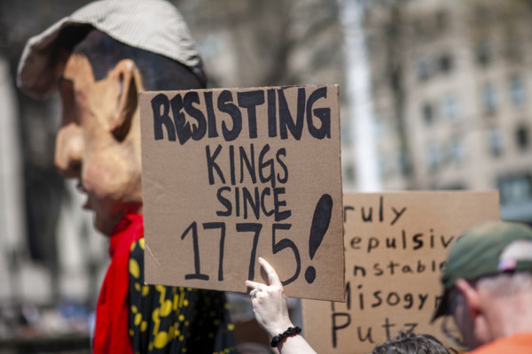 Demonstrators participating in "Our City, Our Fight: Protect Migrants, Protect the Planet" protest,