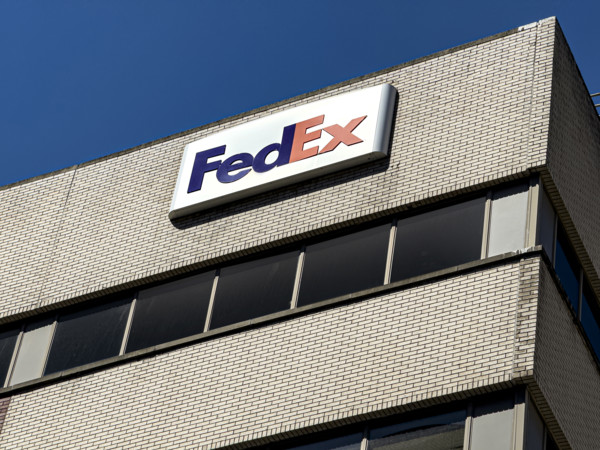 FedEx shipping center, building exterior with logo sign, New York City, New York, USA