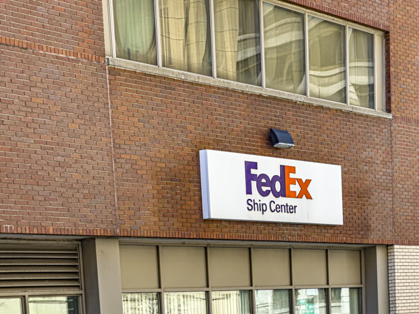 FedEx shipping center, building exterior with logo sign, New York City, New York, USA