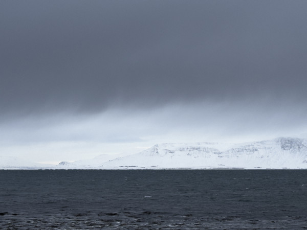 Mt. Esja viewed across inlet from Seltjarnarnes, Capital Region, Iceland on moody winter day