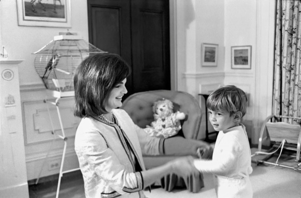 U.S. First Lady Jacqueline Kennedy playing with her son, John F. Kennedy, Jr., in John’s nursery,
